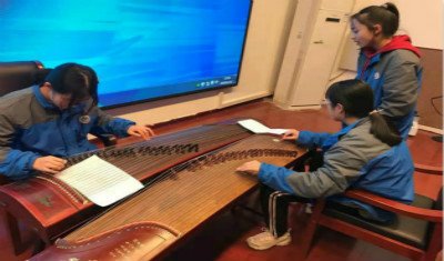 记市实验高中“古筝社”12·12活动